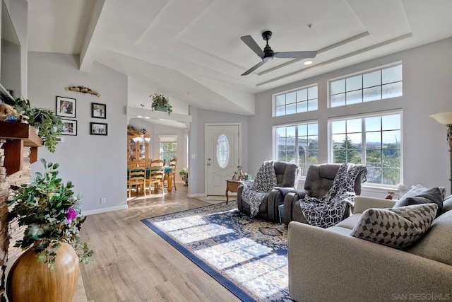 living room with light hardwood / wood-style floors and ceiling fan