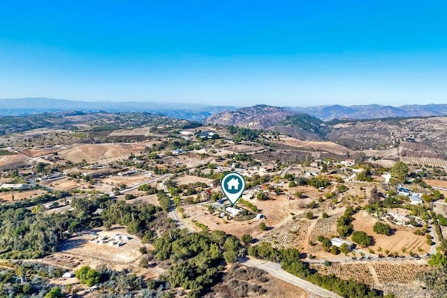 drone / aerial view featuring a mountain view