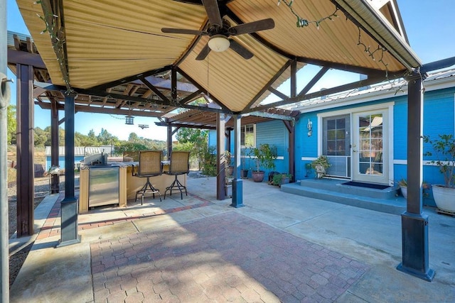 view of patio / terrace featuring a gazebo and an outdoor bar