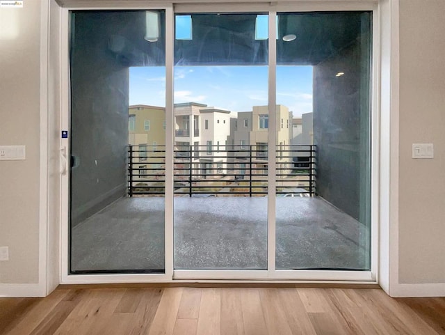 doorway with light hardwood / wood-style floors