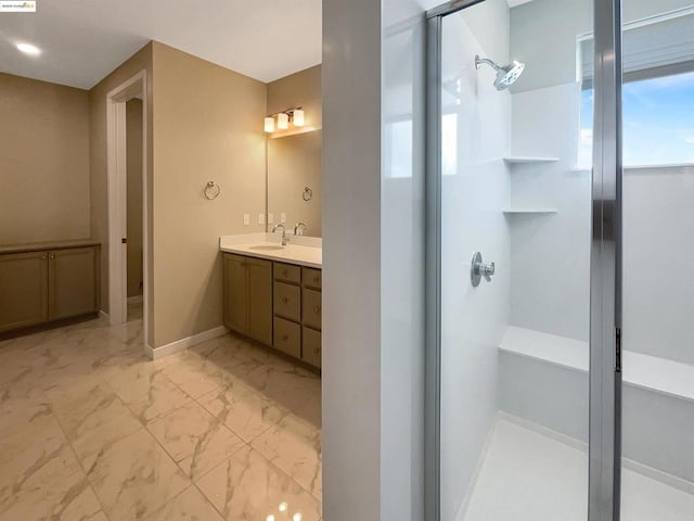 bathroom with a shower and vanity