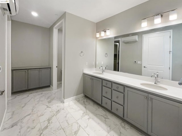 bathroom with vanity and a wall mounted air conditioner