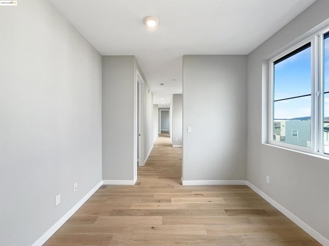 corridor featuring light hardwood / wood-style floors