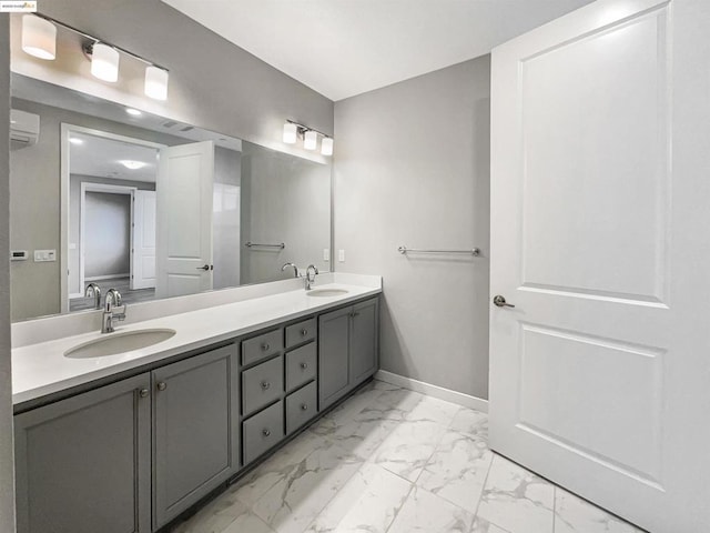 bathroom with a wall mounted air conditioner and vanity