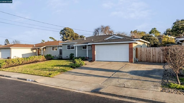 ranch-style house with a garage and a front yard