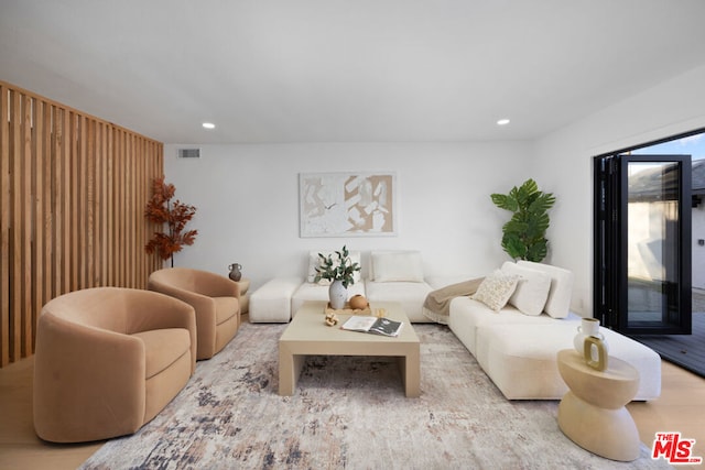 living room with light hardwood / wood-style flooring