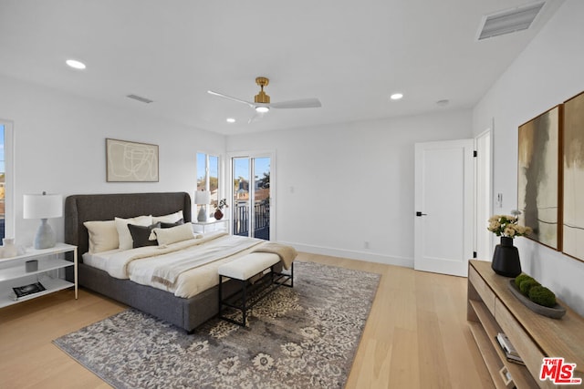 bedroom featuring light wood-type flooring, ceiling fan, and access to exterior