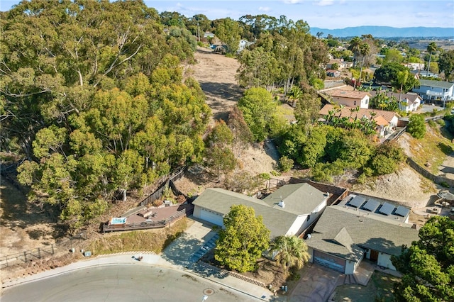 birds eye view of property with a mountain view