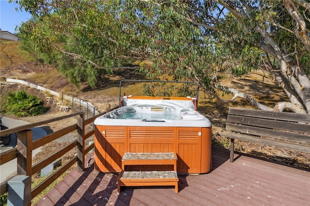 deck featuring a hot tub