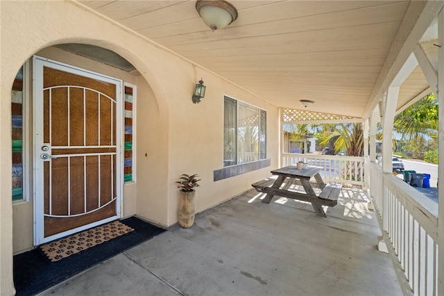 property entrance featuring covered porch