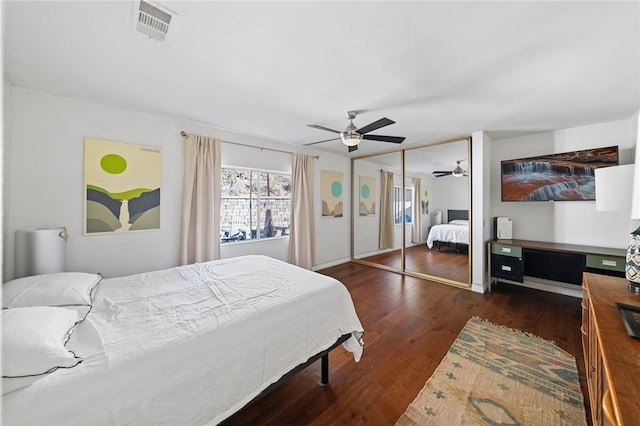 bedroom featuring ceiling fan and dark hardwood / wood-style flooring