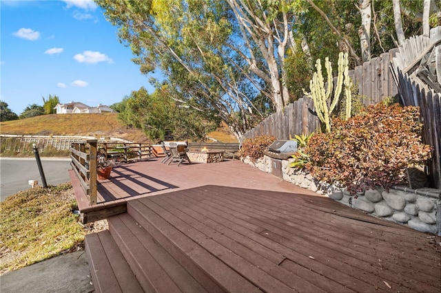 wooden deck with a grill