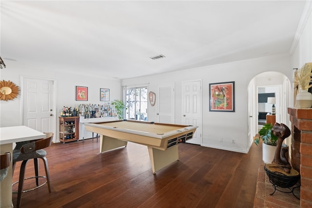 rec room featuring dark hardwood / wood-style floors, ornamental molding, and billiards