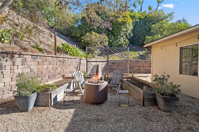 view of patio featuring an outdoor fire pit