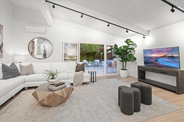 living room with wood ceiling, rail lighting, hardwood / wood-style floors, vaulted ceiling with beams, and a wall unit AC