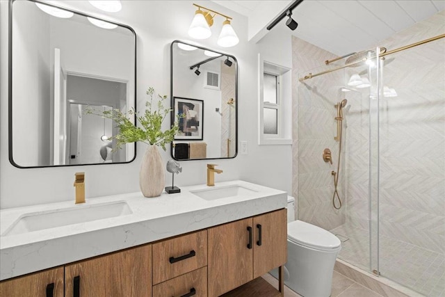 bathroom featuring vanity, an enclosed shower, tile patterned floors, and toilet