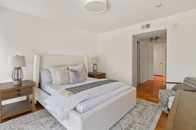 bedroom with parquet flooring