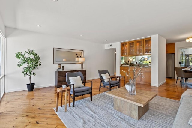 living room with light hardwood / wood-style flooring