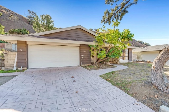 single story home featuring a garage