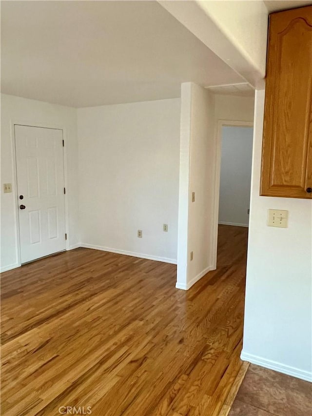 spare room featuring hardwood / wood-style floors