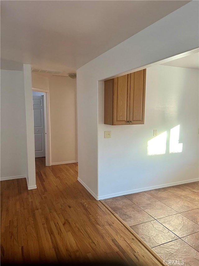 unfurnished room with light hardwood / wood-style floors