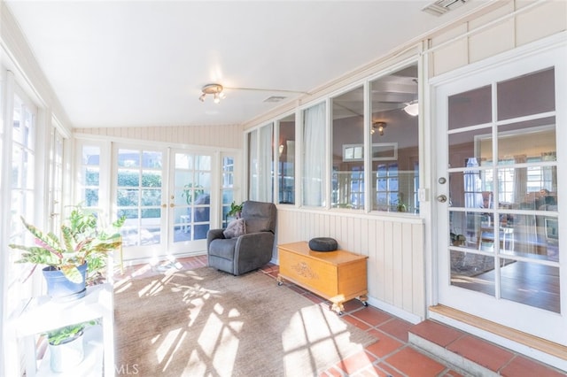 sunroom featuring lofted ceiling