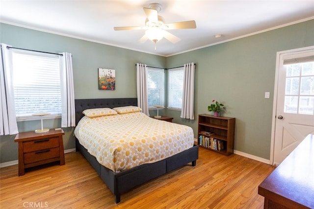 bedroom with multiple windows, ornamental molding, light wood-type flooring, and ceiling fan