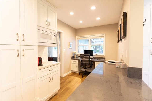 office area with light wood-type flooring