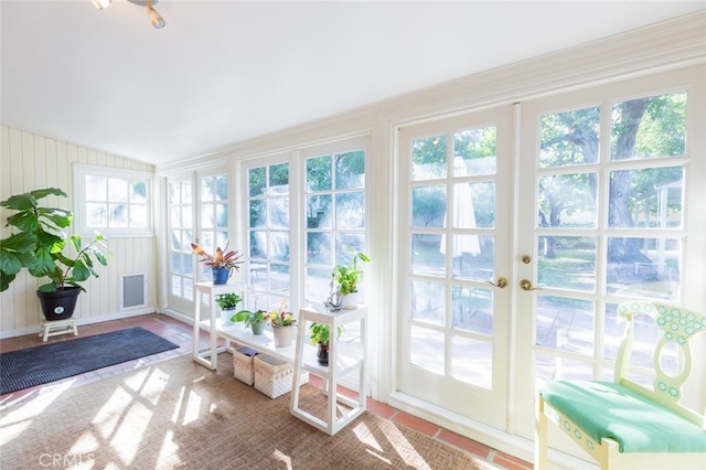 entryway featuring lofted ceiling and tile patterned floors