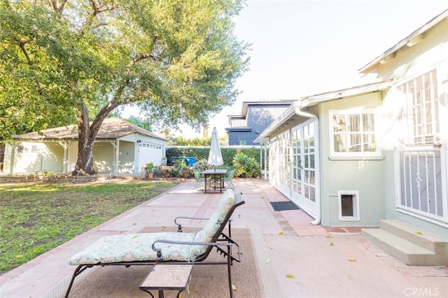 view of patio featuring a garage