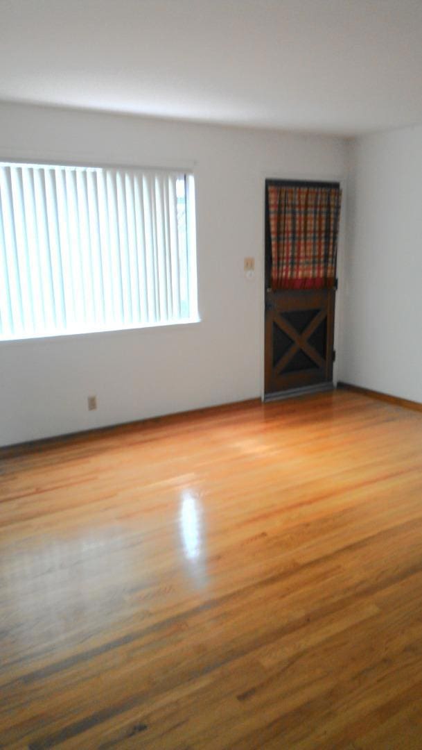 interior space with hardwood / wood-style floors