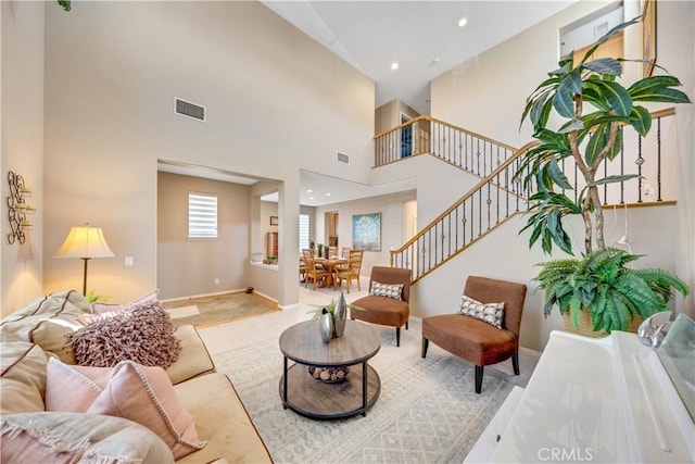 living room with a high ceiling