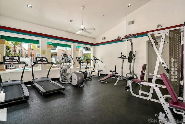 gym featuring a healthy amount of sunlight, lofted ceiling, and ceiling fan