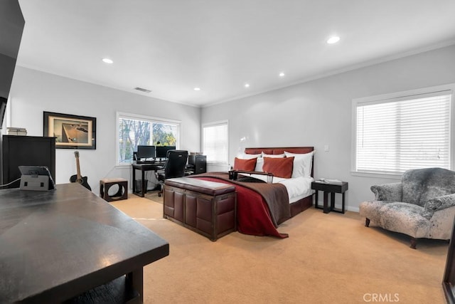 bedroom with light carpet and ornamental molding