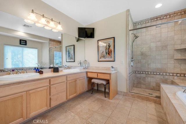 bathroom with vanity, tile patterned flooring, and independent shower and bath