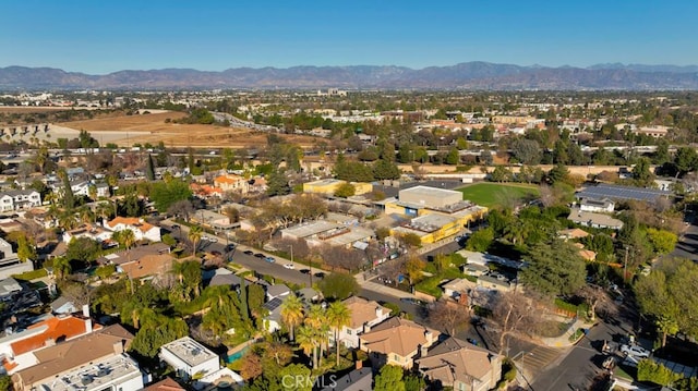 birds eye view of property with a mountain view