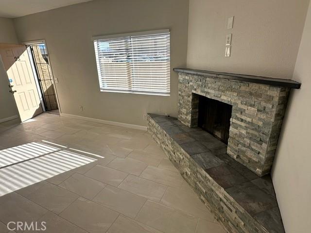 unfurnished living room featuring a fireplace