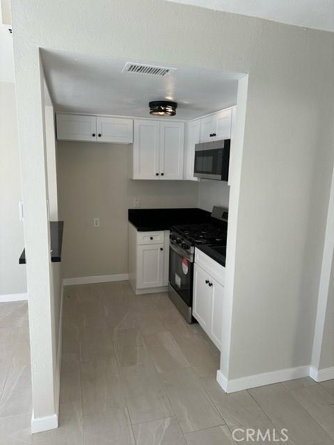 kitchen with white cabinets and stainless steel appliances