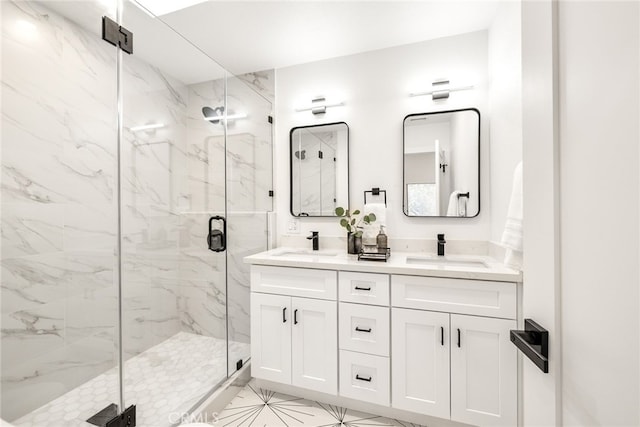 bathroom featuring double vanity, a sink, and a marble finish shower