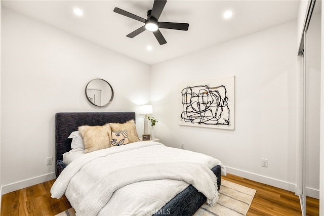 bedroom featuring recessed lighting, baseboards, and wood finished floors