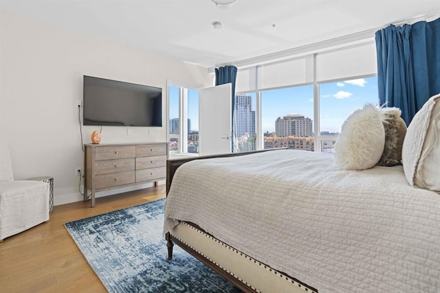 bedroom with hardwood / wood-style floors