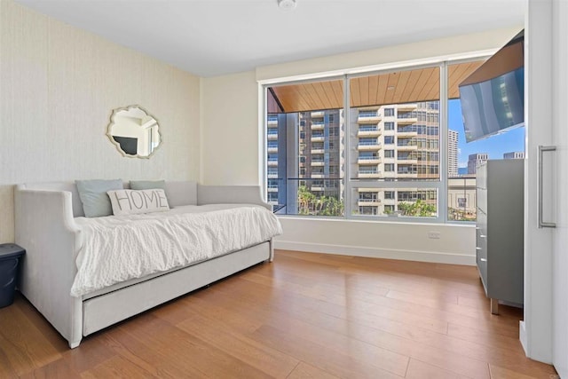 bedroom with hardwood / wood-style flooring