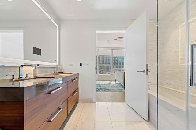 bathroom with walk in shower, tile patterned floors, backsplash, and vanity