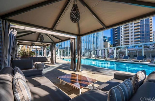 view of pool with an outdoor hangout area and a patio area