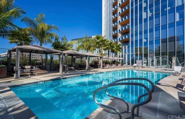 view of swimming pool with a gazebo and an outdoor living space