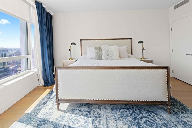 bedroom with light hardwood / wood-style floors