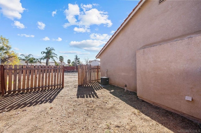 view of yard featuring central air condition unit