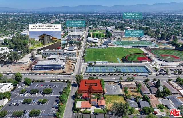 birds eye view of property with a mountain view