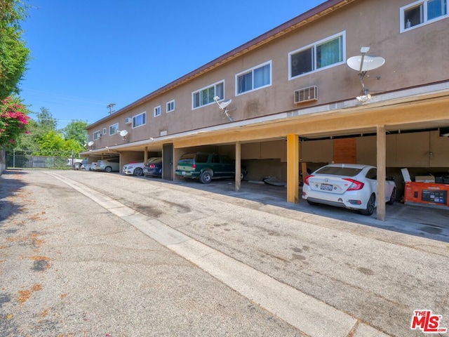 view of vehicle parking featuring a carport