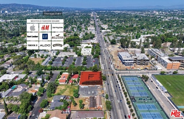 birds eye view of property featuring a mountain view